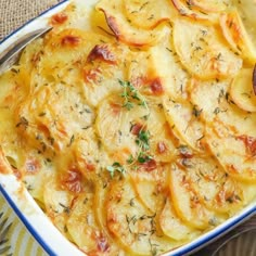 a casserole dish with potatoes and herbs