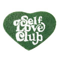 a green heart with the words self love club written on it