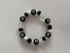 ❦ if you're reading this, then your fortune has been telling you to shake up your accessory game with these beautiful magic 8 ball bracelets! ❦ size: 17cm / 7inches. the string is a stretchy material made to comfortably fit a wide variety of wrist sizes! ❦ created using a wide variety of round clear, white, and black colored beads. also includes the most adorable magic 8 ball beads.  ❦ a lot of these bracelets have absolutely beautiful bead colors, which are the PERFECT addition to your jewelry collection! they'll be such a nice touch as an additional accessory to your clothing. they give off such positive energy & will be perfect to wear for any occasion! you can never go wrong with these bracelets :) ❦ got any further questions or comments? feel free to message me via Etsy or my instagra I Wanna Be Yours Bracelet, 8 Ball Bracelet, Magic 8 Ball, Art Ring, Ball Bracelet, Beads Bracelet Design, Acrylic Charms, Bracelets Handmade Beaded, Jewelry Inspo