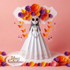 a paper doll wearing a white dress with flowers on her head and butterflies in the background