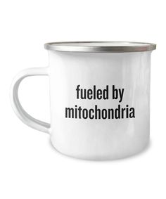 a white enamel mug with the words fueled by mitochondaria printed on it