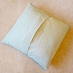 a pillow that is laying on the floor