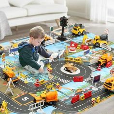 a young boy playing with toys on the floor