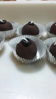 chocolates with white and black decorations on them