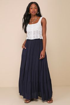 Lulus Exclusive! Dress it up or dress it down, the Lulus Sunset by the Sea Navy Embroidered Tiered Maxi Skirt is perfect for any occasion! Lightweight woven fabric, with embroidered stripes, shapes this swingy skirt that has a high elastic waist and tiered silhouette that ends at a maxi hem. Side seam pockets are perfect for stashing those essentials! Fit: This garment fits true to size. Length: Ankle length. Size medium Waist: Fitted - elastic waist allows stretch. Hip: Not Fitted - fuller skirt allows room for hips. Fabric: Fabric has no stretch. Fully lined. Shell: 85% Rayon, 15% Linen. Lining: 100% Rayon. Hand Wash Cold. Do Not Bleach. Line Dry. Iron Low Heat. Imported. Lulus | Sunset by the Sea Navy Embroidered Tiered Maxi Skirt | Size X-Small | 100% Rayon. Maxi Skirts For Short Women, Navy Maxi Skirt Outfit, Tiered Skirt Outfit, Outfit Estate, Navy Maxi Skirt, Sunset By The Sea, A Line Maxi Skirt, Embroidered Stripes, Teen Style