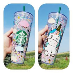 someone holding up a starbucks cup with unicorns on it and rainbow sprinkles