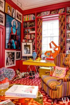 a brightly colored room with pictures on the walls