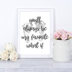 a white vase filled with pink roses next to a framed print that says, soul always be