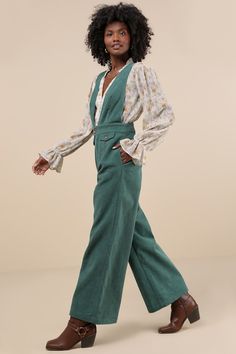 It's easy to become a layering expert when you have a perfect piece like the Lulus Autumn Energy Green Corduroy Wide-Leg Overall Jumpsuit! This sturdy woven corduroy jumpsuit has an overall-inspired design that will pair seamlessly with all your favorite turtlenecks. The sleeveless bodice features a plunging V-neckline and wide shoulder straps, atop a banded waist with a brown button closure and a hidden zip fly. Trendy wide legs boast decorative flap pockets (with matching brown buttons), convenient side seam pockets, and ankle-length hems. Fit: This garment fits true to size. Length: Floor length. Size medium measures 57" from shoulder to hem. Inseam: 29.00 Front Rise: 14.50 Bust: Great for any cup size. Waist: Fitted - very fitted at natural waist. Hip: Loosely Fitted. Fabric: Fabric ha Brown 70s Outfit, 70s Outfit, Corduroy Jumpsuit, 70s Outfits, Overall Jumpsuit, Green Corduroy, Wide Legs, Green And Brown, Ankle Length