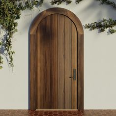 an open wooden door in front of a white wall