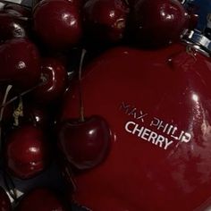 a close up of cherries with the words mix phil cherry on them in white lettering