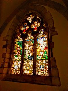 an old stained glass window in a church