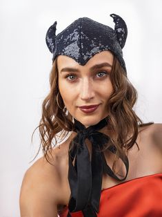 The headpiece features black sequin fabric and playful horns, making it a perfect addition to any costume.  One size fits most, head circumference- 22-23 inches.  Lightweight and comfortable to wear all night long. The bonnet is completely lines and has long ties, which you can tie into a bow, leave hanging like a scarf, or style however you like. Fits a variety of Halloween and Cosplay costumes. Pair it with your evening outfit and turn it into a Halloween or party costume with just one headpie Adjustable Ears Costume Accessories For Party, Adjustable Ears Costume Accessories For Costume Party, Adjustable Costume Accessories With Ears For Costume Party, Fitted Novelty Costume Accessories With Cat Ears, Witchy Winter Party Costume Hats And Headpieces, Halloween Costume Accessories With Ears, Fitted Cat Ears Halloween Costume Accessories, Fitted Black Cat Ears Costume Accessories, Fitted Halloween Costume Accessories With Cat Ears