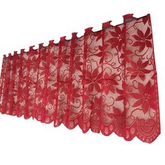 red lace curtain with flowers on it