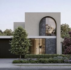 an architectural rendering of a modern house with large arched windows and brickwork on the front