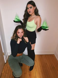 two women dressed in costumes posing for the camera