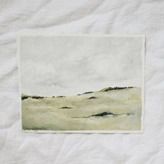 a white sheet with a painting on it