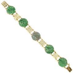 1940's Art Deco Jade bracelet in slightly green gold with certified untreated round Jadeite Jade. 5 green 18.7mm x 2.0mm round carved Jadeite Jade, natural, no enhancements and no treatments, GIA certificate #2205069196 Length: 7 inches 14k green gold 21.6 grams Tested and stamped: 14k Hallmark: WL Carved Jade Round Bracelets, Carved Jade Bracelets, Vintage Round Jade Bracelets, Vintage Jade Round Bracelets, Vintage Jade Bracelets, Carved Jade Bracelet, Luxury Green Bracelets, Carved Green Round Jewelry, Green Carved Round Jewelry