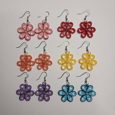 Quilled flower drop earrings in various colors.   Flowers measure about one inch across. Quilling Earring Patterns, Multicolor Flower Earrings For Spring, Multicolor Flower Earrings As Gift, Spring Multicolor Flower Earrings With Ear Wire, Multicolor Flower Earrings For Gifts, Multicolor Handmade Flower Earrings, Spring Teardrop Flower Earrings For Pierced Ears, Multicolor Flower Shaped Earrings For Gift, Multicolor Flower Shaped Earrings With Ear Wire