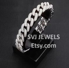 Material: 925 Sterling Silver  Diamond Type: Cubic Zirconia Diamond Color: White  Width:14mm Diamond Shape: Round Cut Package Content :A Bracelet, A Gift box Our jewelry: In-kind Shooting, Lasting shine, Perfect gift with fashion and quality. TO MAKE CUSTOM DESIGN THEN DM US. Why to choose us ? We are jewelry manufacturer. You will get jewelry at CHEAPEST RATE with high quality finish. Jewelry Manufacturers, Micro Pave, Silver Diamonds, Chain Link Bracelet, Arm Band, Diamond Shapes, Colored Diamonds, Favorite Jewelry, Jewelry Bracelets