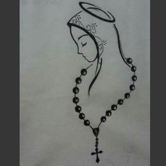 a drawing of a rosary with a woman's face in the center and a cross on it