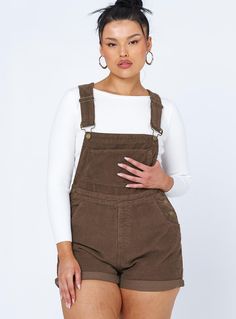 Overalls    100% cotton  Alicia is wearing a size AU 14 / US 10  Cord material  Adjustable buckle straps  Button fastening at sides  Large chest pocket    Classic four pockets   Gold-toned hardware   Fixed rolled hem  Non-stretch   Unlined Overalls Brown, Brown Overalls, Spring Rompers, Corduroy Dungarees, Baby Crop Top, Black Overalls, Pink Formal Dresses, Festival Tops, Playsuit Romper