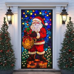 a stained glass door decorated with christmas lights and santa clause holding a sack of presents