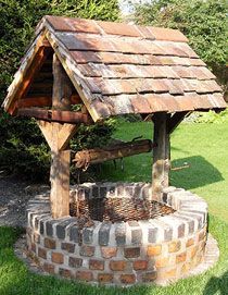 an outdoor fire pit made out of bricks