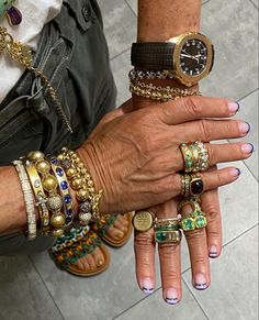 a variety of gold rings, bracelets, and watches worn on 2 hands posed under a camera. Luxury Feminine Silver Jewelry, Luxury Lifestyle Jewelry, Bling Aesthetic Outfit, Loads Of Jewelry, 90s Fashion Jewelry, Marla Aaron Bracelet, Lots Of Jewelry Outfits, Mariela Core Aesthetic, Gold Vintage Jewelry Aesthetic