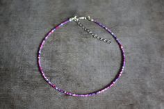 ✦ INFORMATION ✦ Choker with 2 mm purple pink white and blue mix glass seed beads.  There are 3 sizes available: 32 - 39 cm (7 cm extended chain) 34 - 41 cm (7 cm extended chain) 36 - 43 cm (7 cm extended chain) ✦ CUSTOM ORDER ✦ Would you like another length, charm, color or something totally else? No problem! Just message me with all of your wishes and we will work it out. ✦ SHIPPING & PACKAGING ✦ The items will be send 1-5 days after payment. The package will be send from the Amsterdam, The Net Violet Rose, Choker Jewelry, Bohemian Beach, Silver Plated Jewelry, Jewelry Choker, Glass Seed Beads, Beaded Choker, Necklace Handmade, The Net