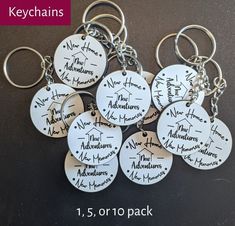 six keychains with names on them sitting next to each other