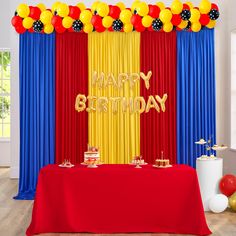 a birthday party with red, yellow and blue decorations