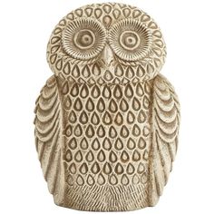 an owl figurine is shown on a white background