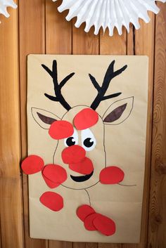 paper plate reindeer craft for kids to make on the wall next to a white fan