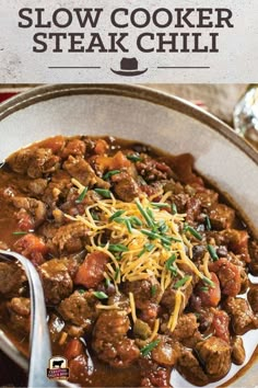 slow cooker steak chili in a white bowl with a spoon on the side and text overlay