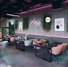 an empty restaurant with pink chairs and plants growing on the wall behind it, along with neon lights