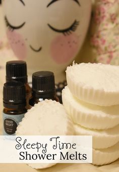 three bottles of sleep time shower melts sitting next to each other on a table