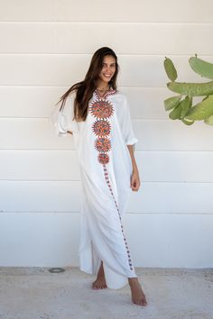 This beautiful free size Kaftan has a unique presence to it. It's colorful and most importantly comfortable wear, light and soft and can be used on many occasions -  home gatherings, dinners, or just in your home to feel comfortable.  Fabric : 80% Egyptian Cotton and 20% Polyester Measurements : Free size. Fits up to 4XL. Also there is a belt that can be used to tighten the dress around the hips.  Bust size : 78 inches Length : 145 inches For reference the model is a size 4 US and 5'8". As you c White Embroidered V-neck Kurta, White Cotton Kurta With Geometric Embroidery, White V-neck Kaftan For Spring, Bohemian White V-neck Cover-up, Traditional White V-neck Maxi Dress, White Free Size Maxi Dress For Beach Cover-up, White V-neck Bohemian Kimono, White V-neck Embroidered Dress For Festival, White V-neck Kimono For Festival