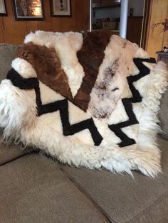 a blanket that is sitting on top of a couch