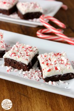 peppermint brownies with white frosting and candy canes on the side