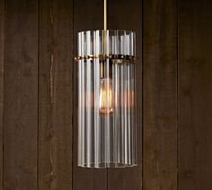 a light that is hanging from a wooden wall with some lights on it's side