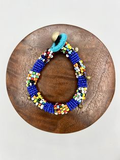 Colorful Bohemian Blue Stretch Bracelet With Colorful Beads, Blue Bohemian Stretch Bracelet With Colorful Beads, Blue Wooden Beads For Festival, Adjustable Turquoise Beaded Bracelets With Wooden Beads, Bohemian Blue Bracelets With Colorful Beads, Adjustable Blue Beaded Bracelets With Wooden Beads, Blue Bohemian Bracelets With Colorful Beads, Bohemian Blue Stretch Bracelet With Large Beads, Blue Wooden Beaded Bracelets For Beach