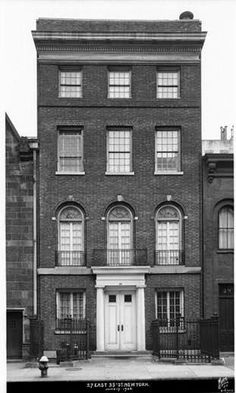 black and white photograph of an old brick building