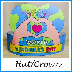 a paper hat with the words world kindness day on it and an image of people holding hands