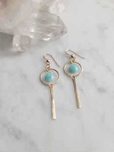 Nova Earrings featuring the Amazonite stone. These gems are such a pretty color! They are light and can be worn with a t-shirt and jeans or with a summer dress. The materials are your choice of 14k Gold Filled or Sterling Silver. Each piece is hammered for texture and shape. The length of the earrings are about 2 in. These are handmade and may vary slightly as well as the stones as they are natural. Thank you! Amazonite Jewelry Handmade, Sterling Silver Earrings For Everyday Summer Wear, Dainty Everyday Earrings For Summer, Dainty Summer Earrings, Bohemian Everyday Gemstone Earrings, Summer Everyday Pierced Earrings, Bohemian Gemstone Earrings For Everyday, Everyday Summer Pierced Earrings, Minimalist Round Earrings For Summer