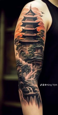 a man with a tattoo on his arm that has a pagoda and waterfall in the background