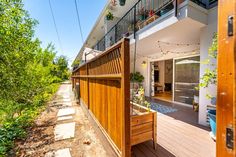 an outside view of a house with wooden decking