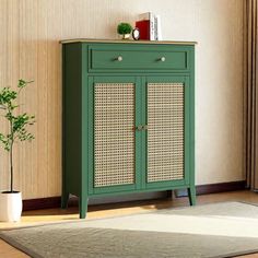 a green cabinet with wicker doors and drawers in a room next to a window