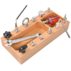 a wooden tool holder with tools in it