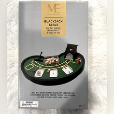 a blackjack table with cards and chips on it in front of a white carpet